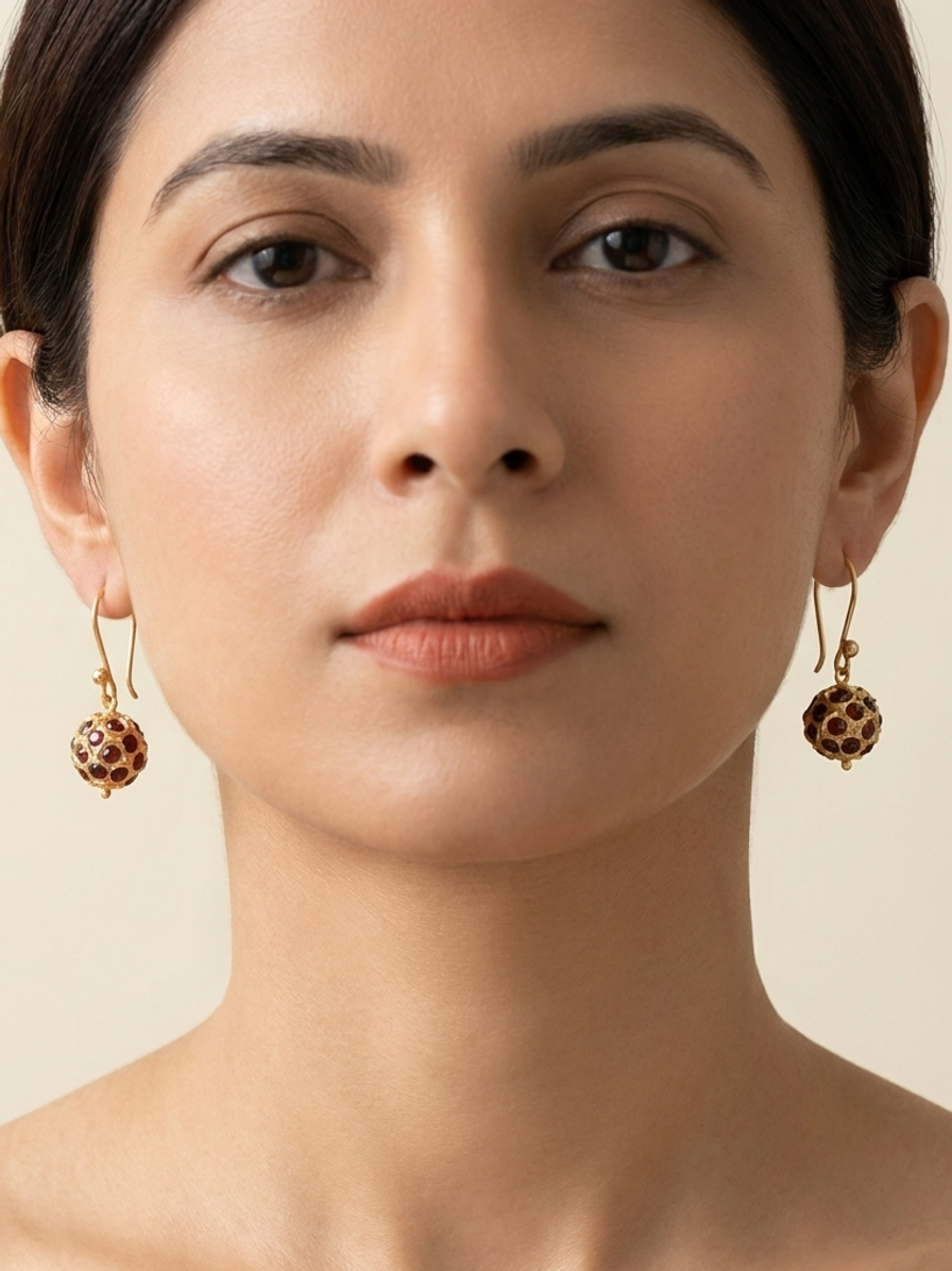 Garnet Pavilion Drops — handmade deep red stones jewelry by Sima & Sid, shown on a model