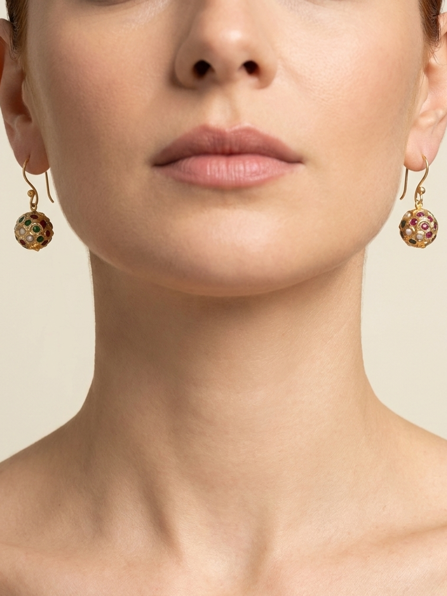 Regal Pavilion Drops — handmade gold-tone metal jewelry by Sima & Sid, shown on a model