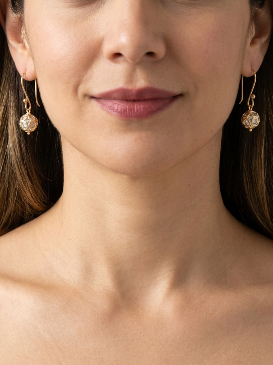 Gilded Constellation Drops — handmade gold-tone beads jewelry by Sima & Sid, shown on a model
