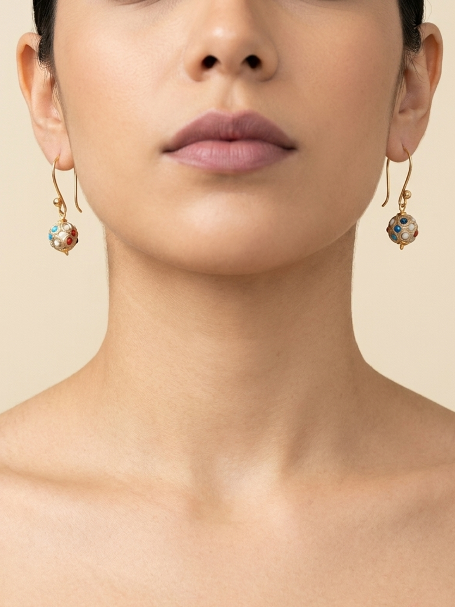 Gilded Carnival Drops — handmade gold-tone metal beads jewelry by Sima & Sid, shown on a model