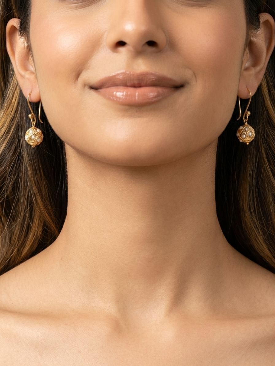 Pearl Filigree Drops — handmade pearl-like beads jewelry by Sima & Sid, shown on a model