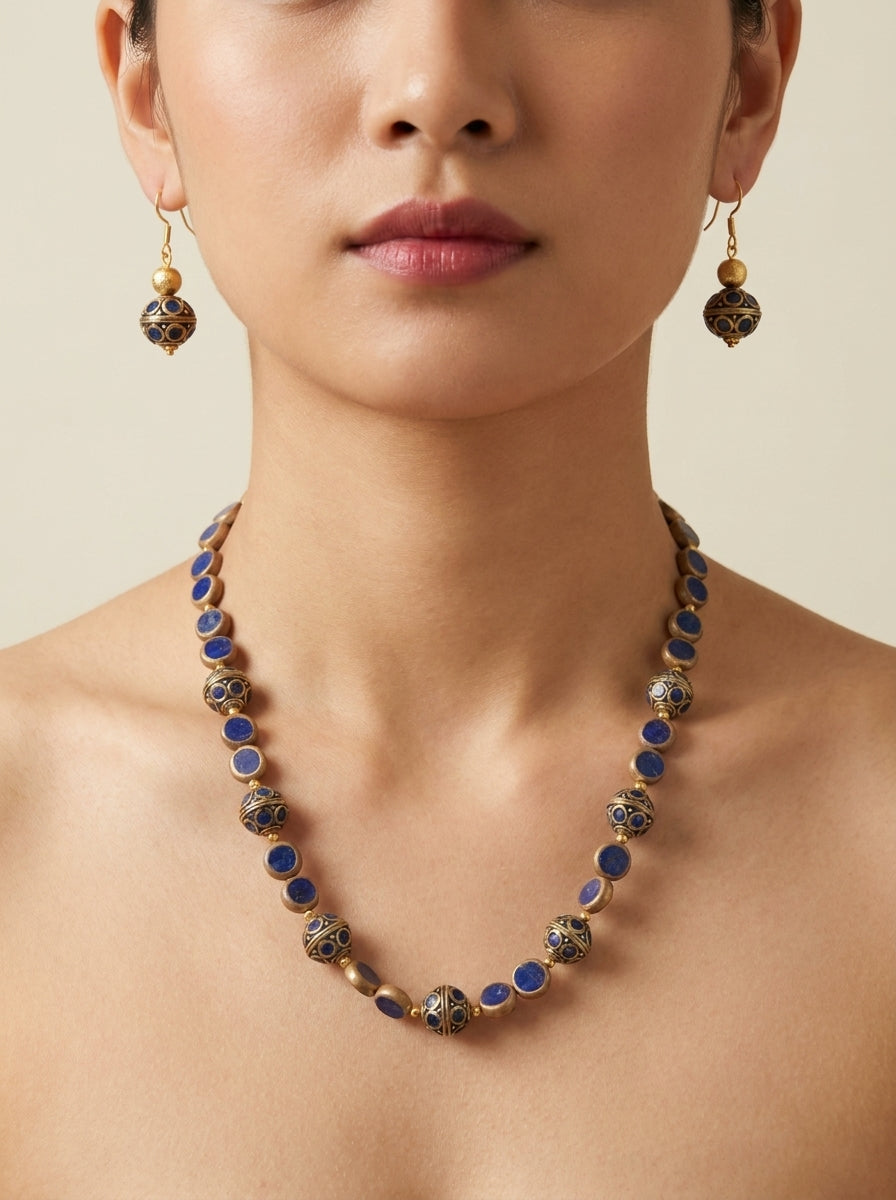 Lapis Pavilion Set — handmade deep blue stone jewelry by Sima & Sid, shown on a model