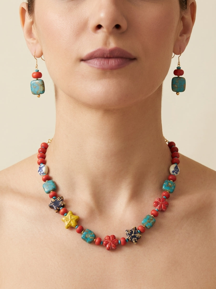 Scarlet Kaleidoscope Set — handmade matte red stone jewelry by Sima & Sid, shown on a model
