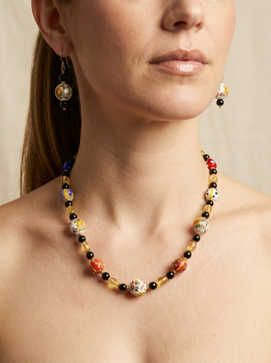Ceramic Kaleidoscope Set — handmade floral ceramic beads jewelry by Sima & Sid, shown on a model