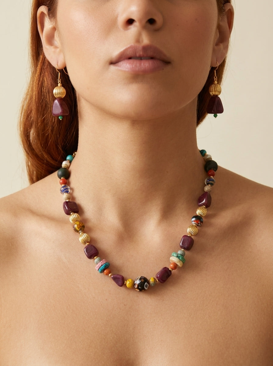 Plum Venetian Set — handmade deep plum stone jewelry by Sima & Sid, shown on a model