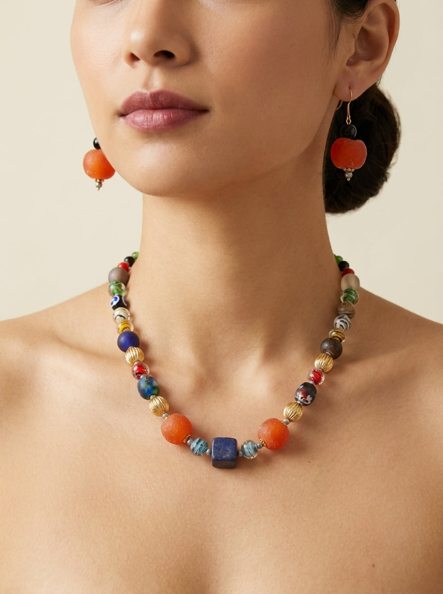 Persimmon Bazaar Set — handmade matte orange resin jewelry by Sima & Sid, shown on a model