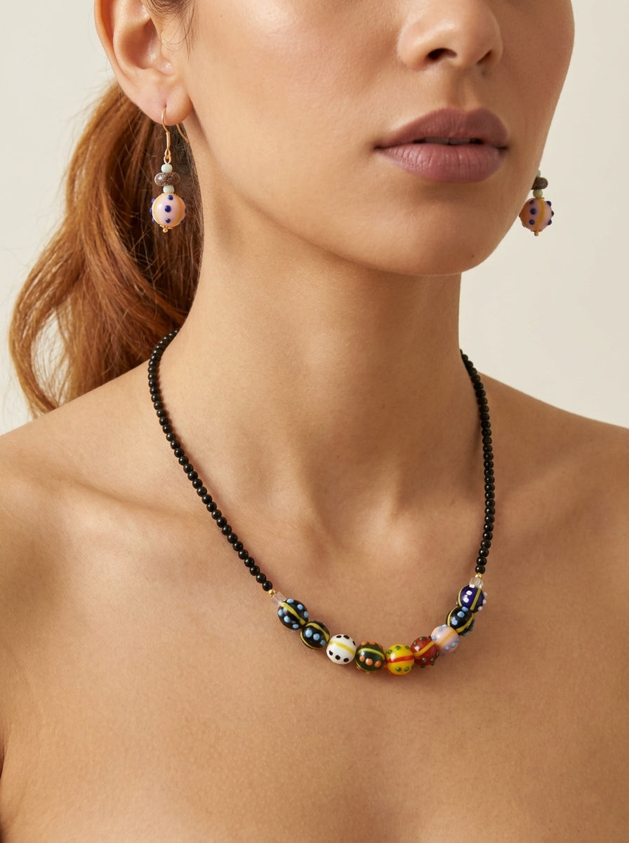 Obsidian Kaleidoscope Set — handmade lampwork glass jewelry by Sima & Sid, shown on a model