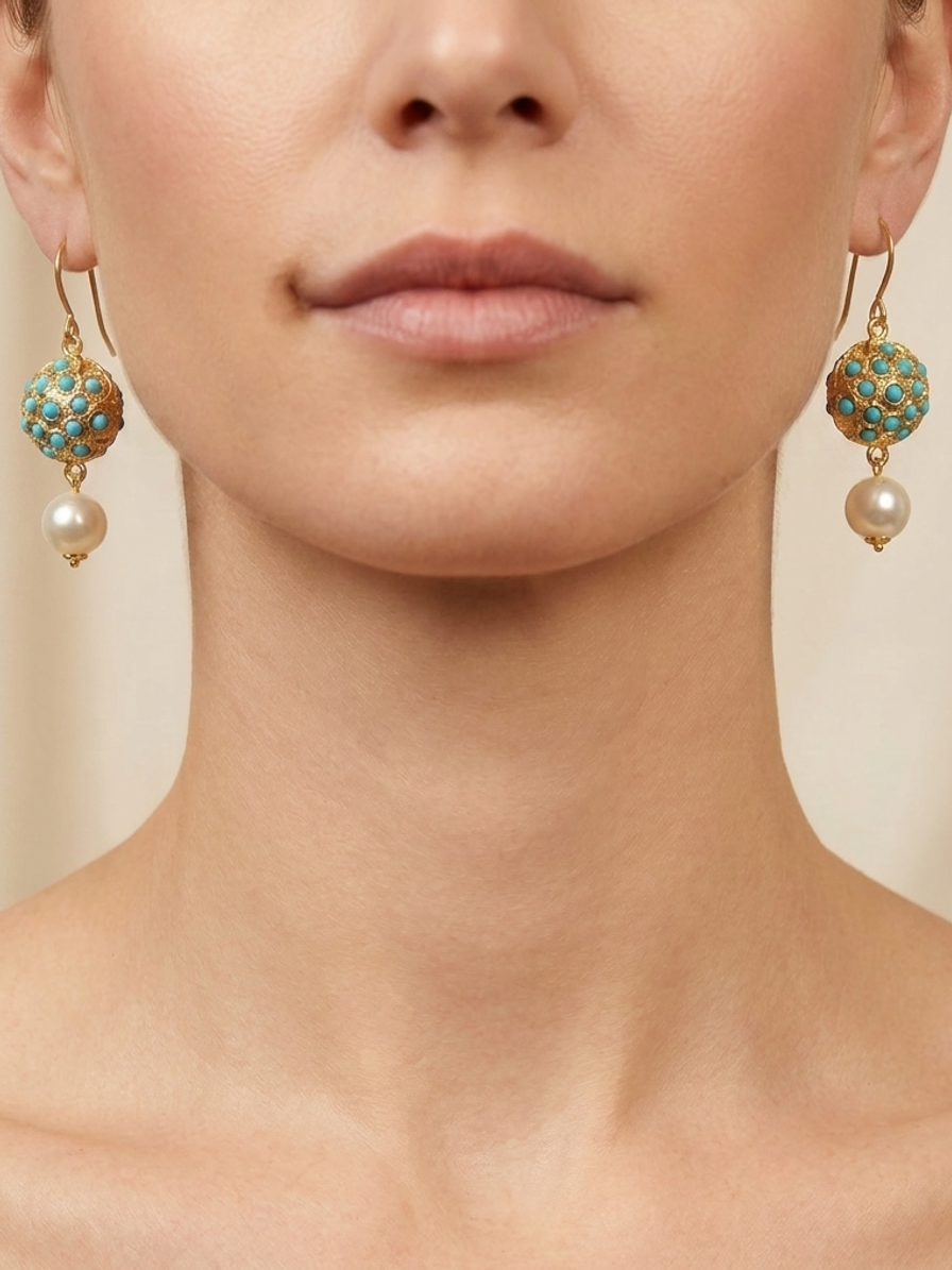 Pearl Pavilion Drops — handmade turquoise-toned stones jewelry by Sima & Sid, shown on a model