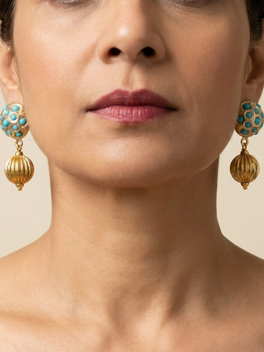 Gilded Lantern Drops — handmade gold-tone metal beads jewelry by Sima & Sid, shown on a model