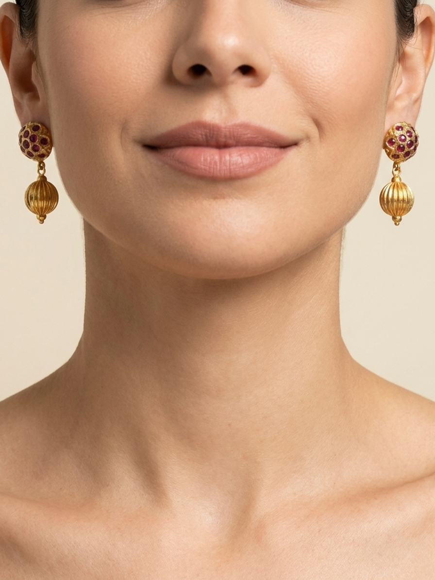 Ruby Majlis Drops — handmade gold-tone metal jewelry by Sima & Sid, shown on a model