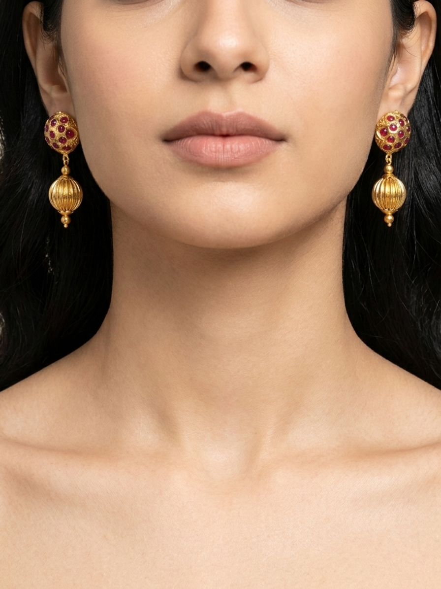 Crimson Temple Drops — handmade gold-tone metal beads jewelry by Sima & Sid, shown on a model