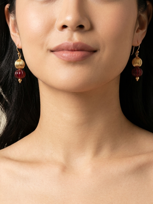 Burgundy Lantern Drops — handmade burgundy glass melon beads jewelry by Sima & Sid, shown on a model