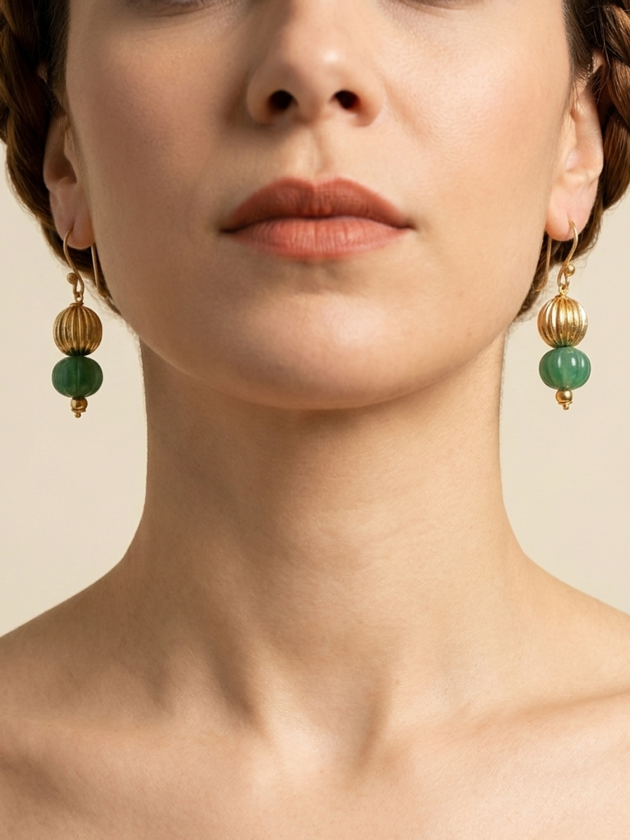 Emerald Lantern Drops — handmade gold-tone metal beads jewelry by Sima & Sid, shown on a model